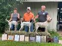 Chuck Maxson positioned in the center, and with a little help, are displaying his string of winners. On the left is Firebug the Winner of the NBHA Open Puppy of the Year, with Chuck in the center is Wild Afire the NBHA Runner-Up Amateur Puppy of the Year, and to the right is Brannigan's Last Straw the NBHA Winner of the Amateur Shooting Dog (jc@f).  Chuck was also the Winner of the NBHA Amateur Puppy Handler of the Year, Winner of the NBHA Amateur Shooting Dog (jc@F) Handler of the Year, and Runner-Up winner of the NBHA Open Puppy Handler of the Year.
