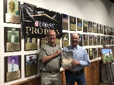 Tim Penn gleefully accepting RU Amateur Shooting Dog of the Year honors for his setter male Penrosa Behrdevil presented by President Ken Sauer.